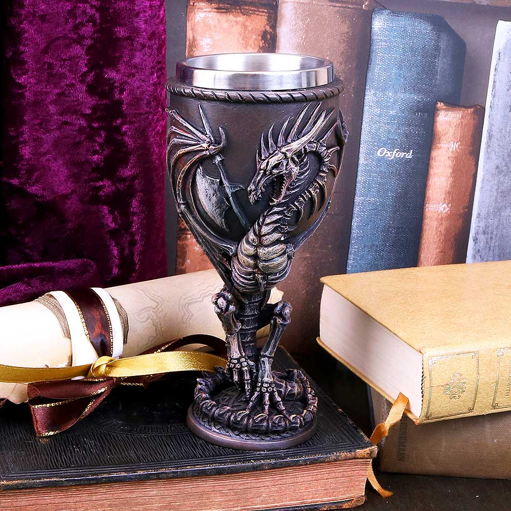 A goblet featuring a fossilised dragon remains design with a stainless steel insert at the top on display