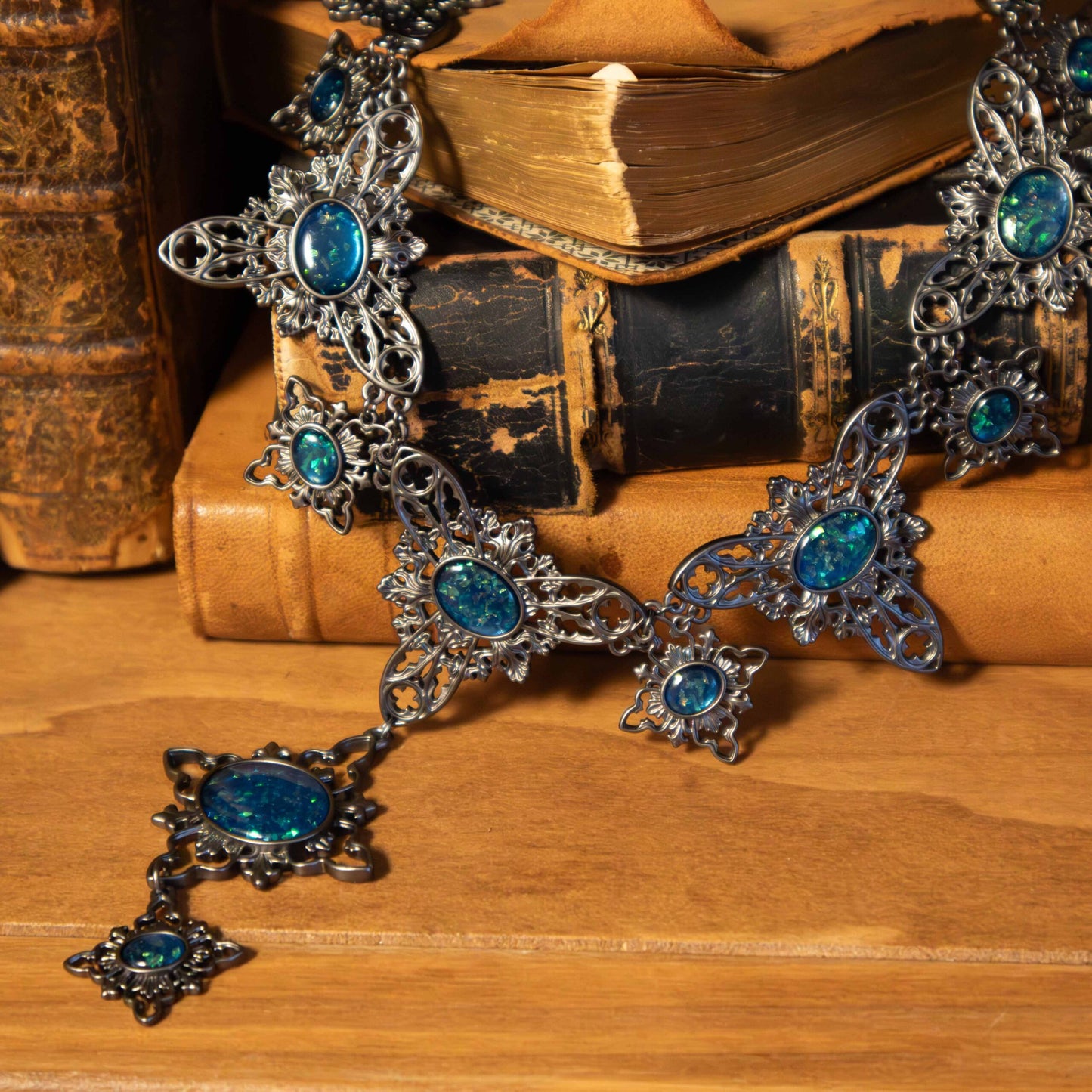 Decorative necklace with blue stones on an old book background