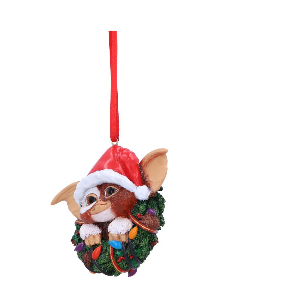 Side view of hand painted festive Gremlins Gizmo wreath ornament