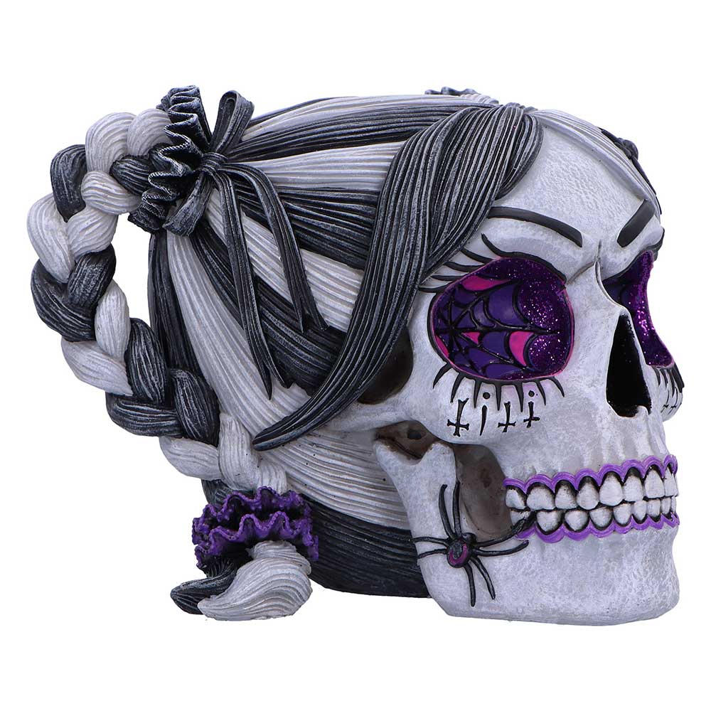 Gothic skull figurine with glitter-filled eyes and spiderweb detailing
