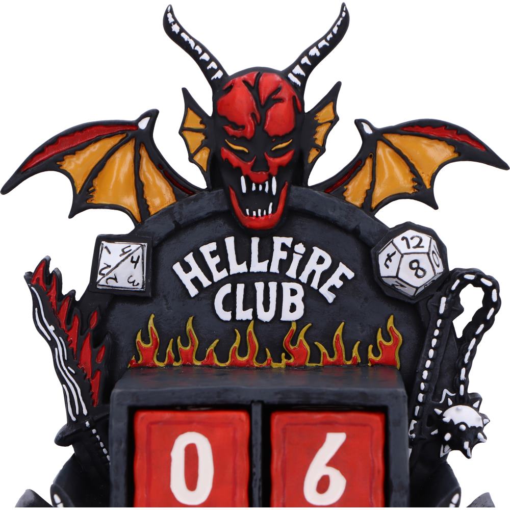 Decorative item with a devil face, 'Hellfire Club' text, and dice