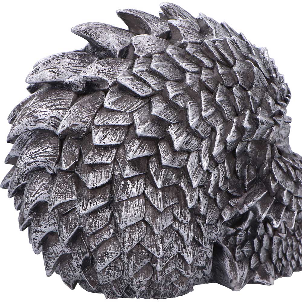 Scaled Remains gothic skull figurine displayed on flat surface