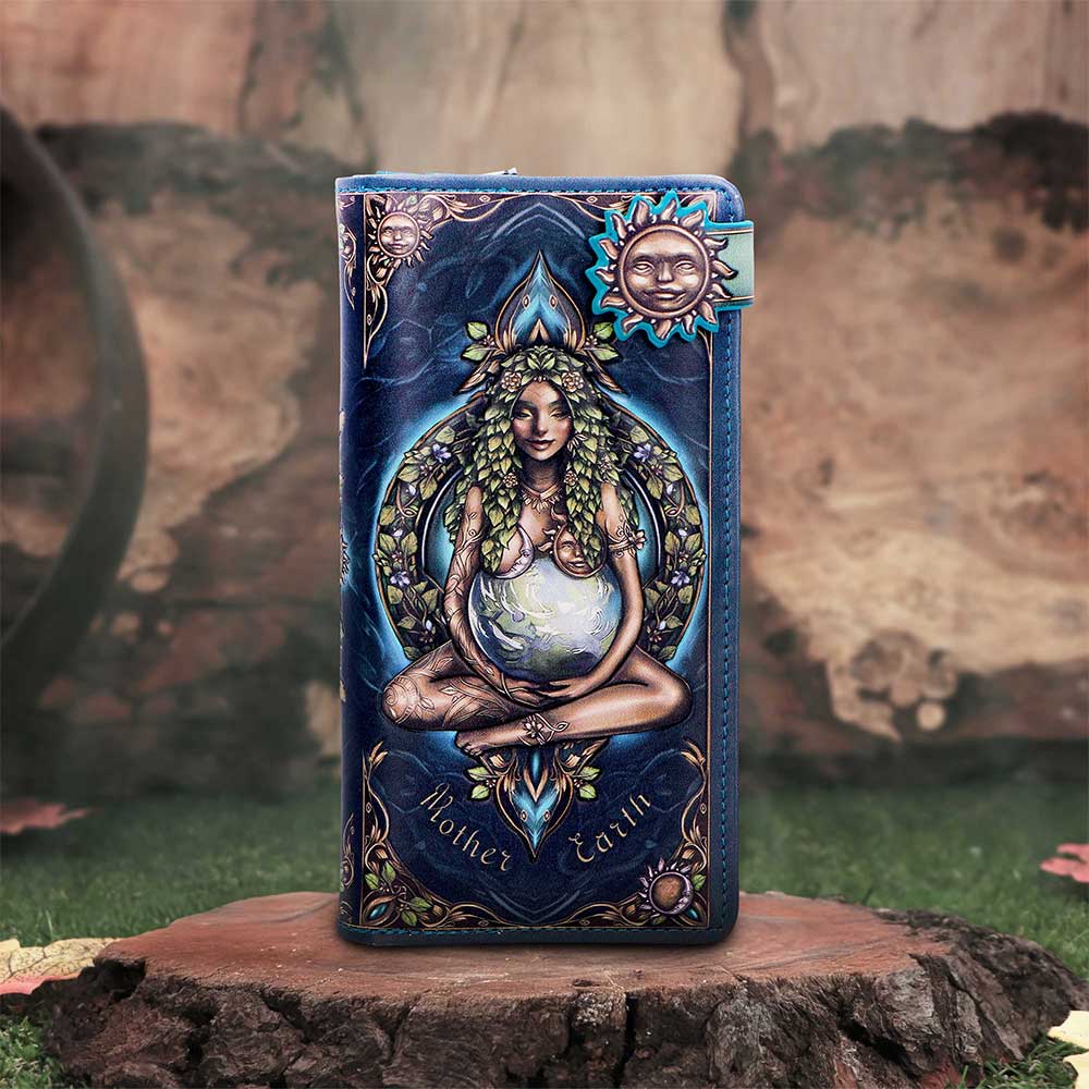 Purse with artistic design of a woman holding a globe, surrounded by nature elements