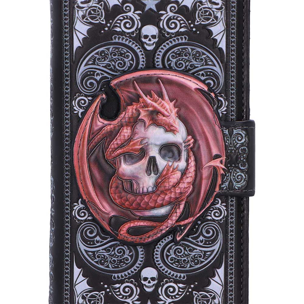 Purse with dragon and skull design on a black and white patterned background