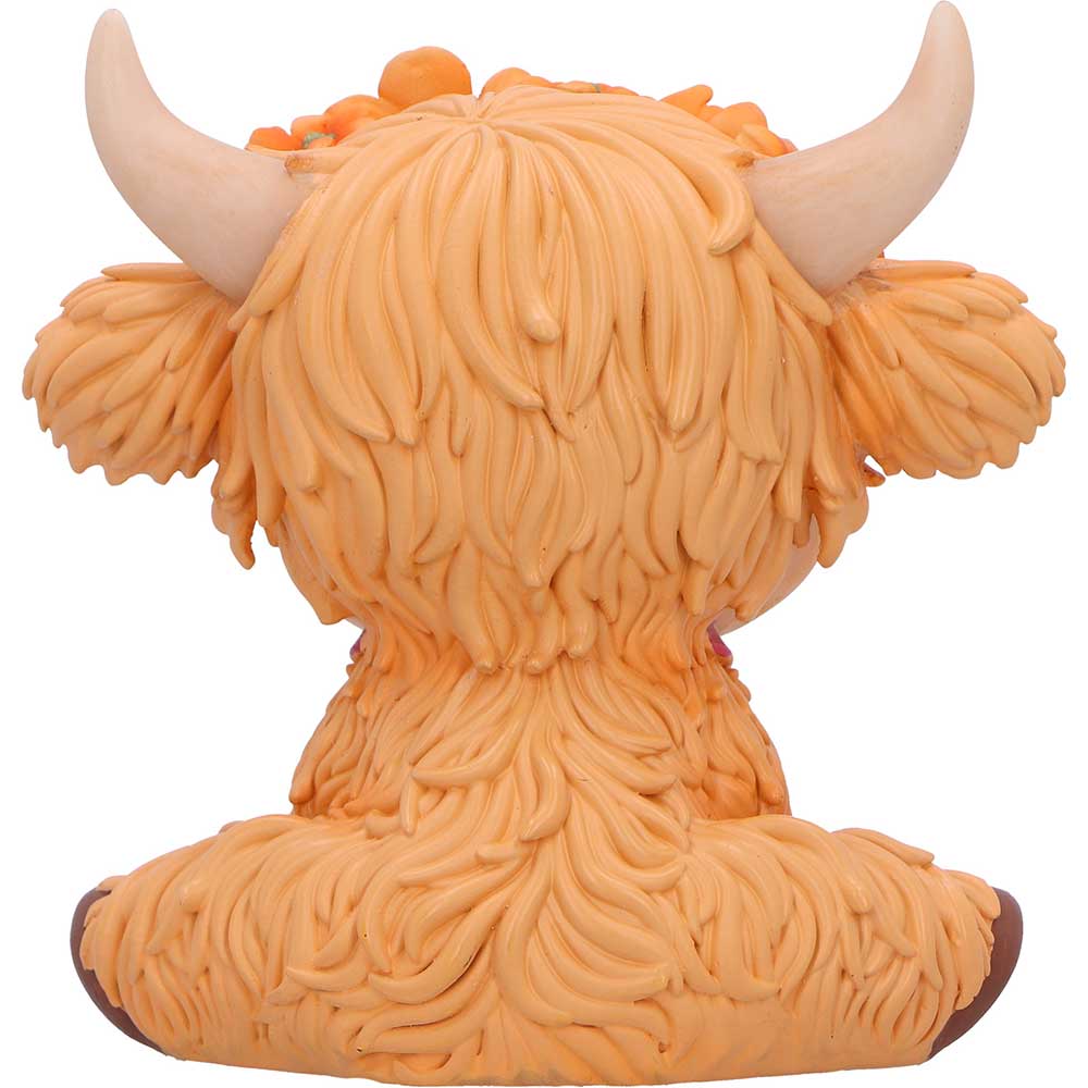 Figure of a cow with orange hair and horns