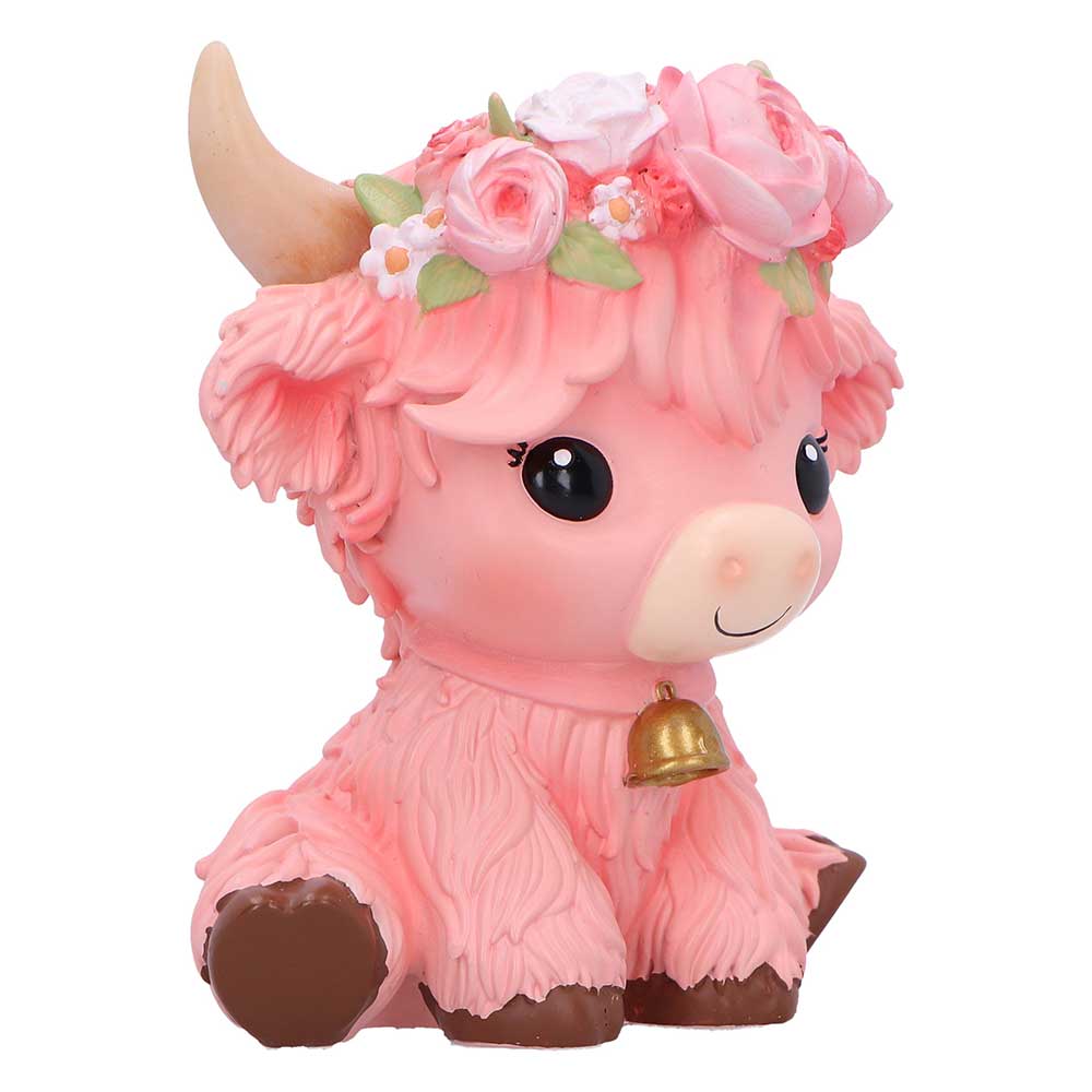 Pink cow figurine with floral crown and bell