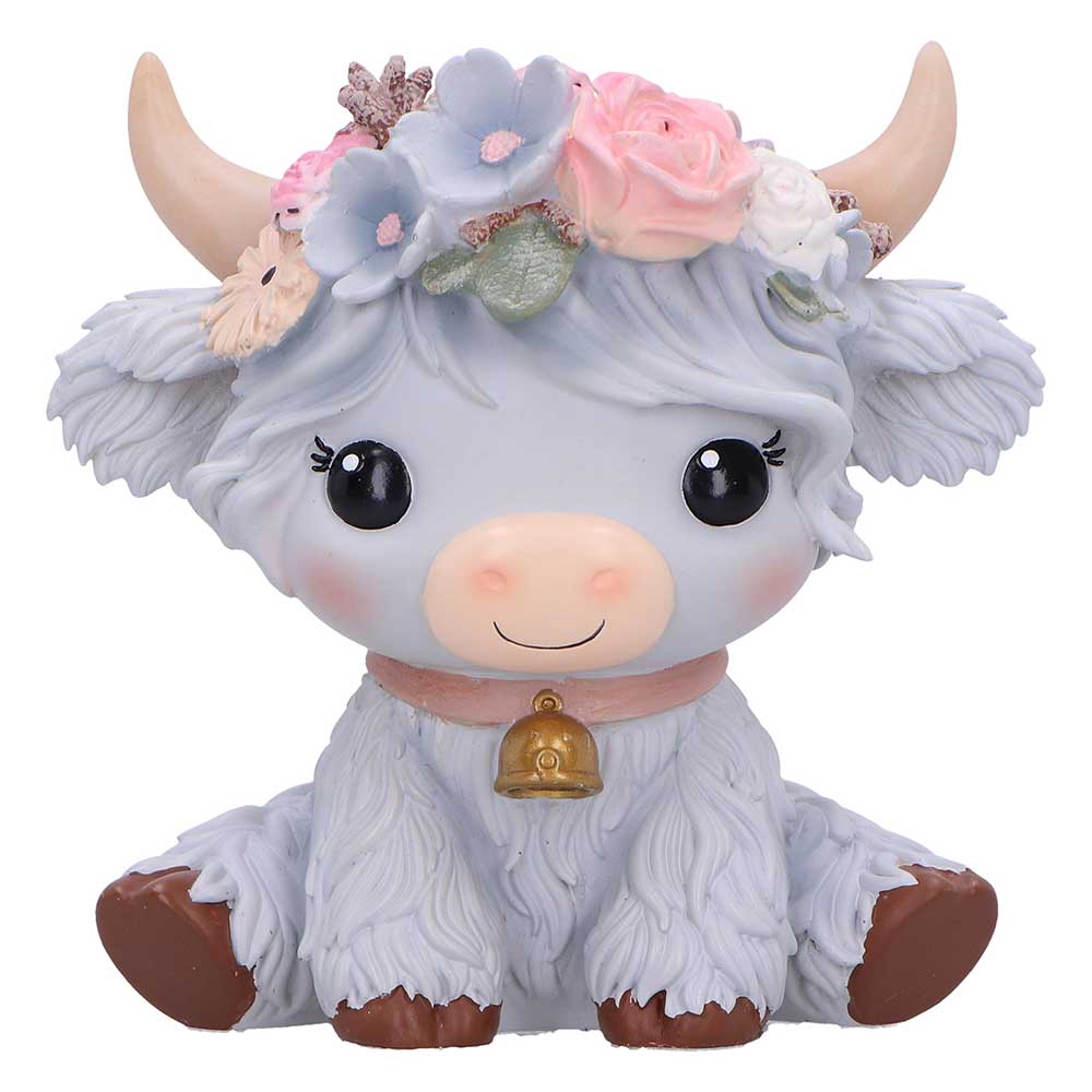 Cute figurine of a cow with floral crown and bell