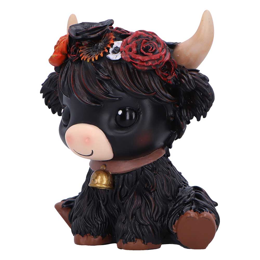 Black cow figurine with flowers