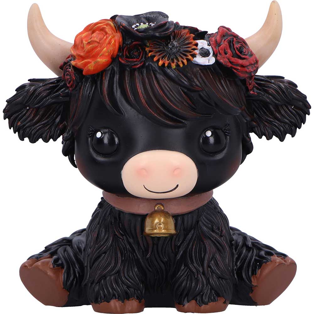 Black figurine with floral headband and bell
