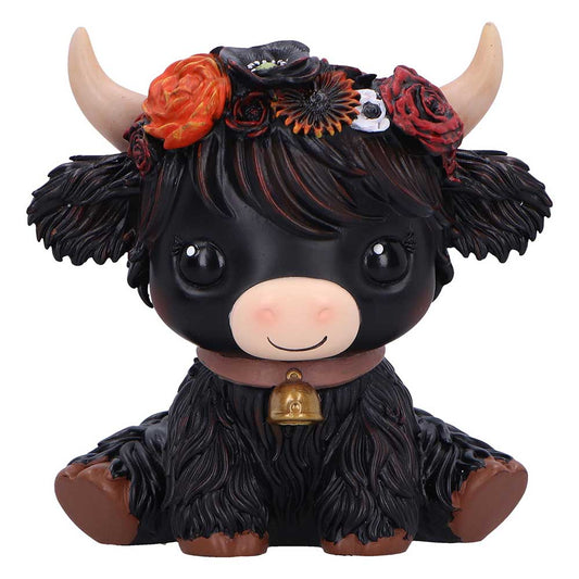 Black cow figurine with floral headband