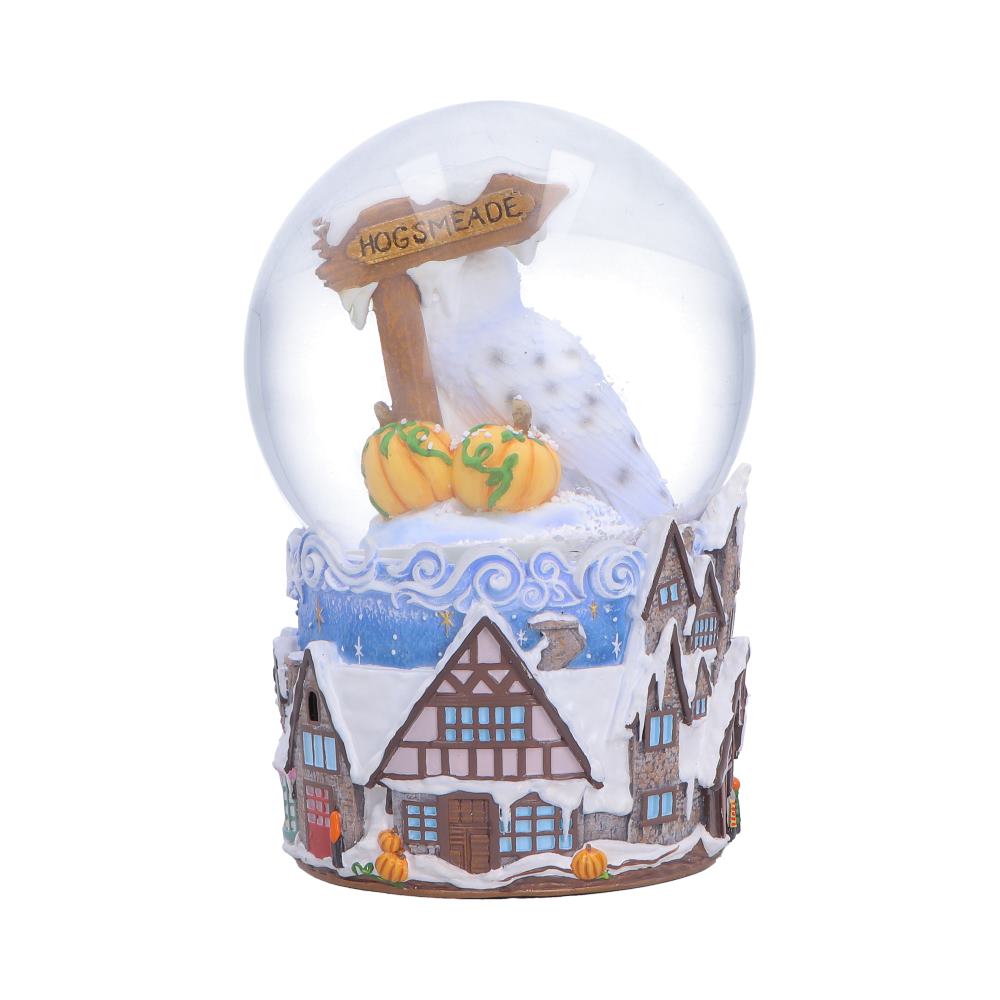 Back view of Harry Potter Hogsmeade Village snow globe showing village detail