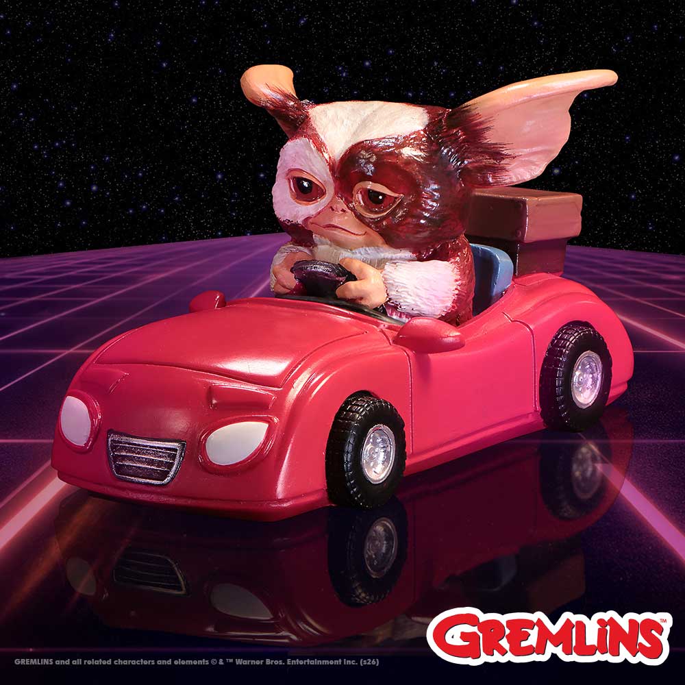 Hand-painted Gremlins Gizmo figurine in red vehicle