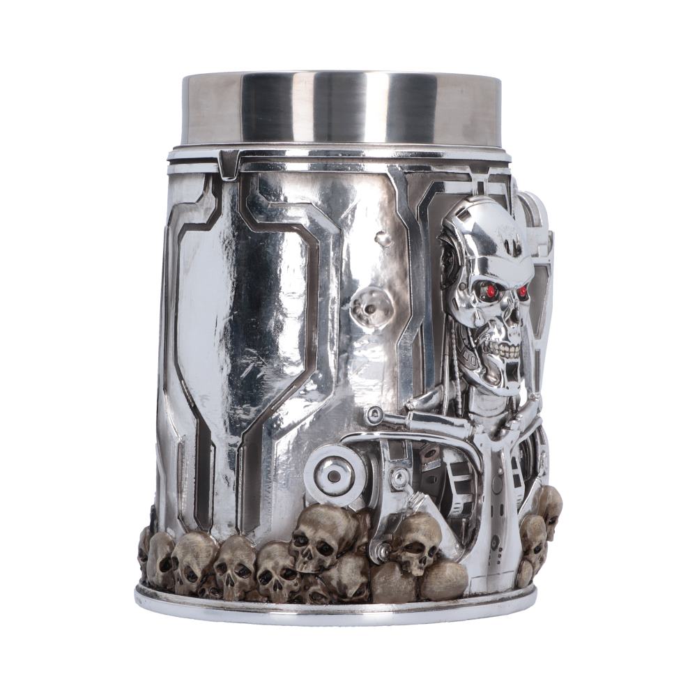 A metallic silver endoskeleton-themed mug featuring a detailed Terminator T-800 skull head, exposed mechanical gears, and a row of small skulls along the base