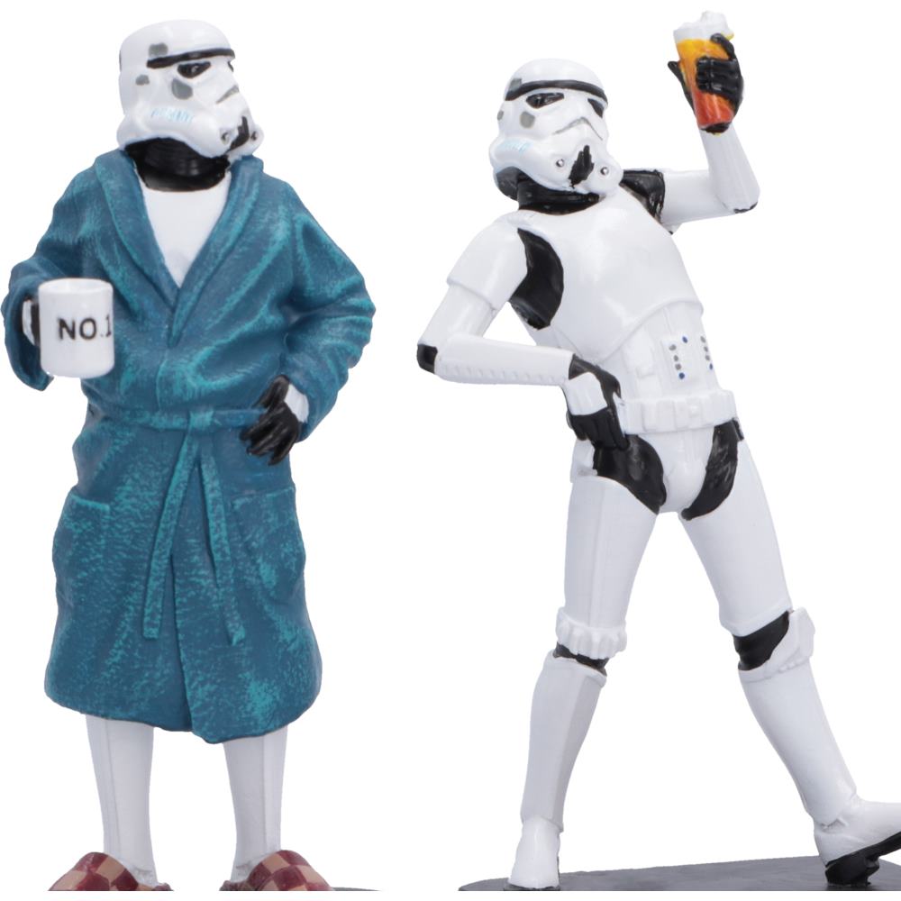 Original Stormtrooper relaxing in a dressing gown with a mug that says "NO!" and white helmet and one in a white stormtrooper-style armor raising a celebratory beer.