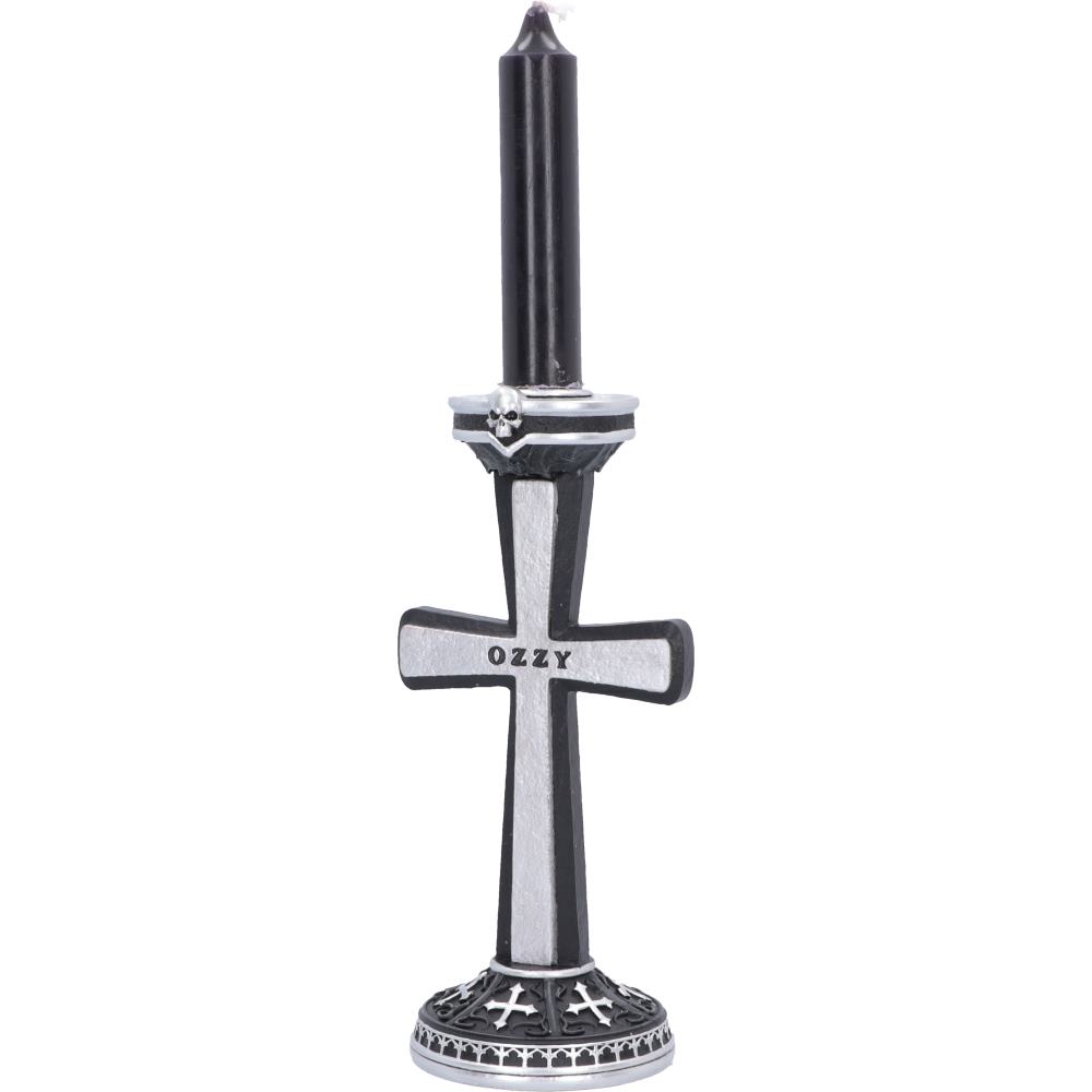 A gothic-style black and silver candle holder featuring a vertical cross with the name 'OZZY' engraved on the front, holding a black taper candle