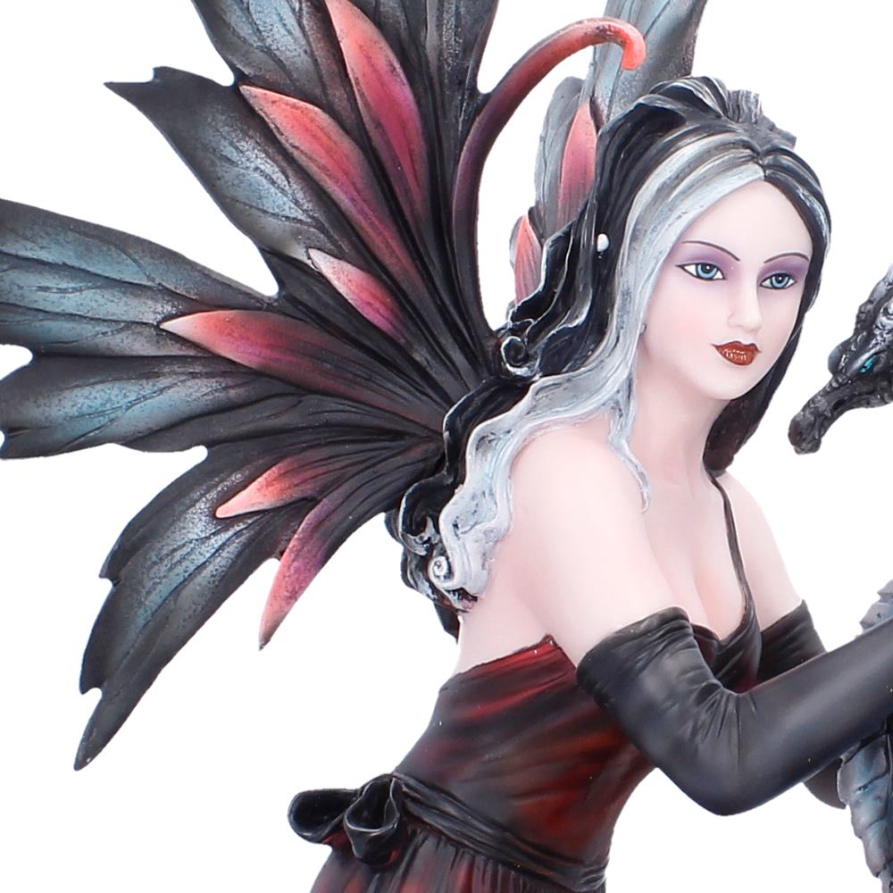 Close view of the Fantasy figurine with large black and red wings