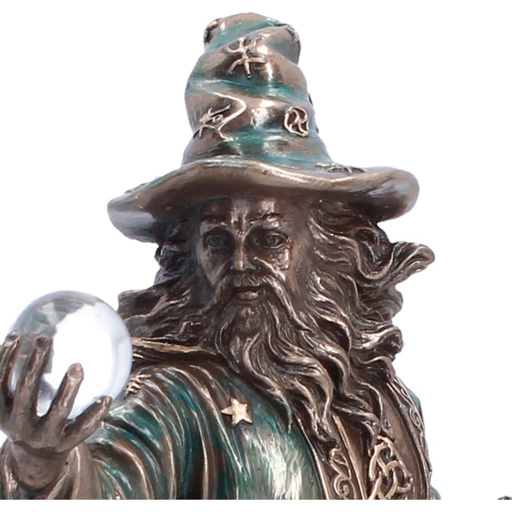 Bronze statue of a wizard holding a crystal ball by Nemesis Now