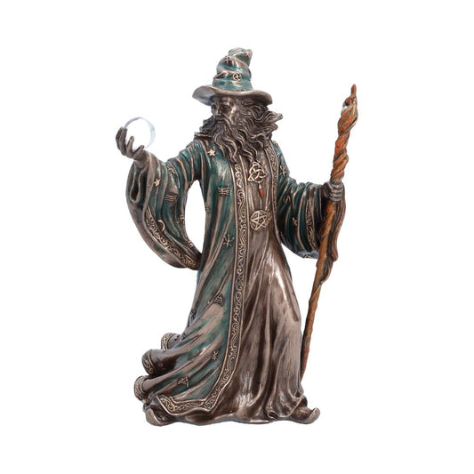 The Sorcerer Wizard Figurine 20cm featuring a bearded wizard holding a crystal ball and staff, wearing flowing bronze-effect robes with dark blue accents and a premium hand-painted resin finish.