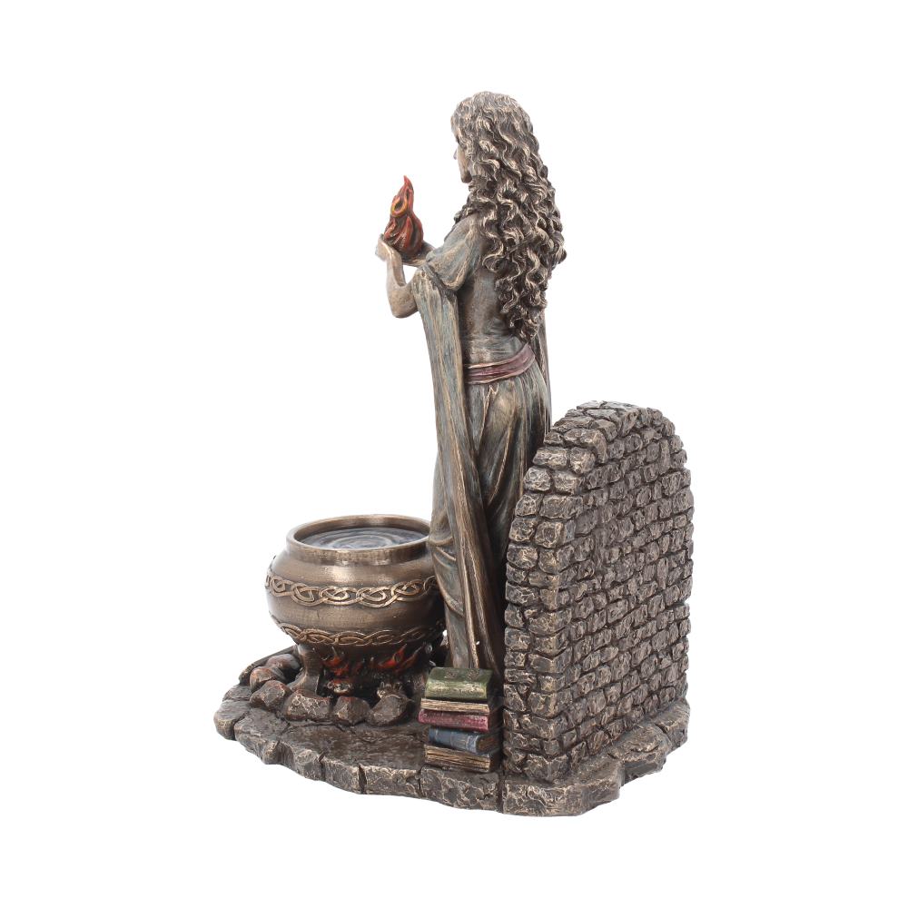 Celtic goddess figurine side view with flowing dress and books