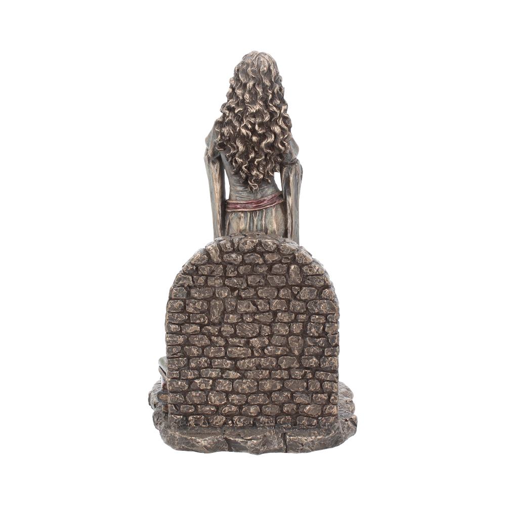 Back view of Brigid figurine with hair open and stone deail