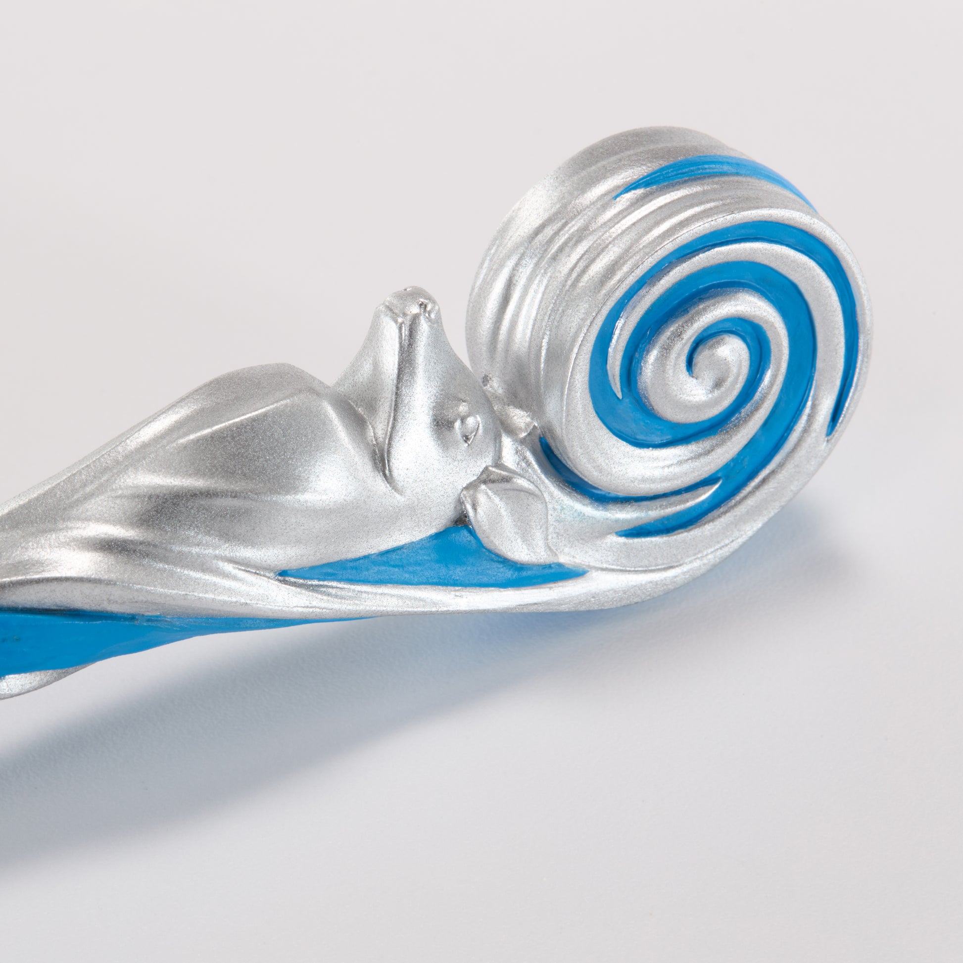 Silver and blue wand with a spiral design