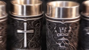 360° view of the Ozzy Osbourne Prince of Darkness Shot Glass Set 8.6cm showcasing four Gothic designs featuring a cross, Ozzy logo, bat and crowned skull.