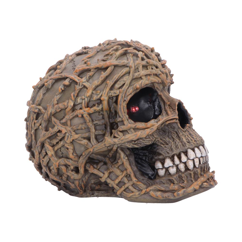 Skull figurine with rooted vine detailing side view