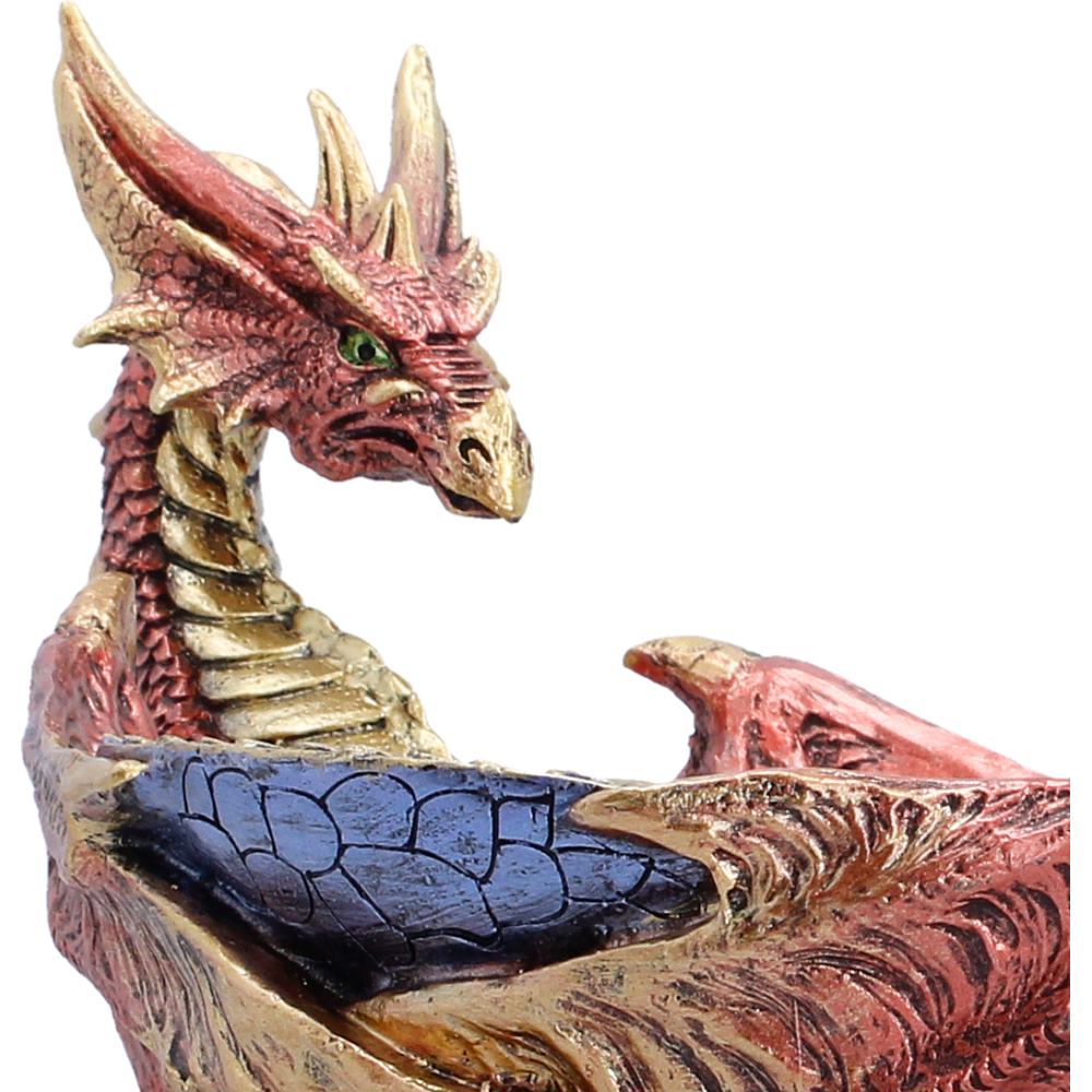 Close-up of dragon sculpted detail on bowl