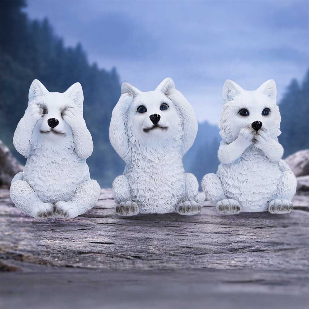 Three Wise wolf ornament set displayed together