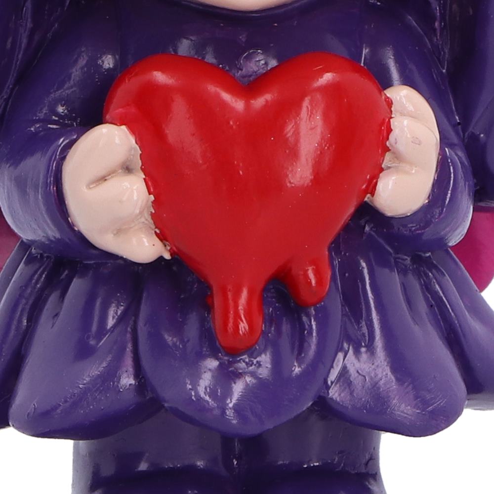 Close-up of Spirit Fairy Mirella holding a melting red heart with dripping detail