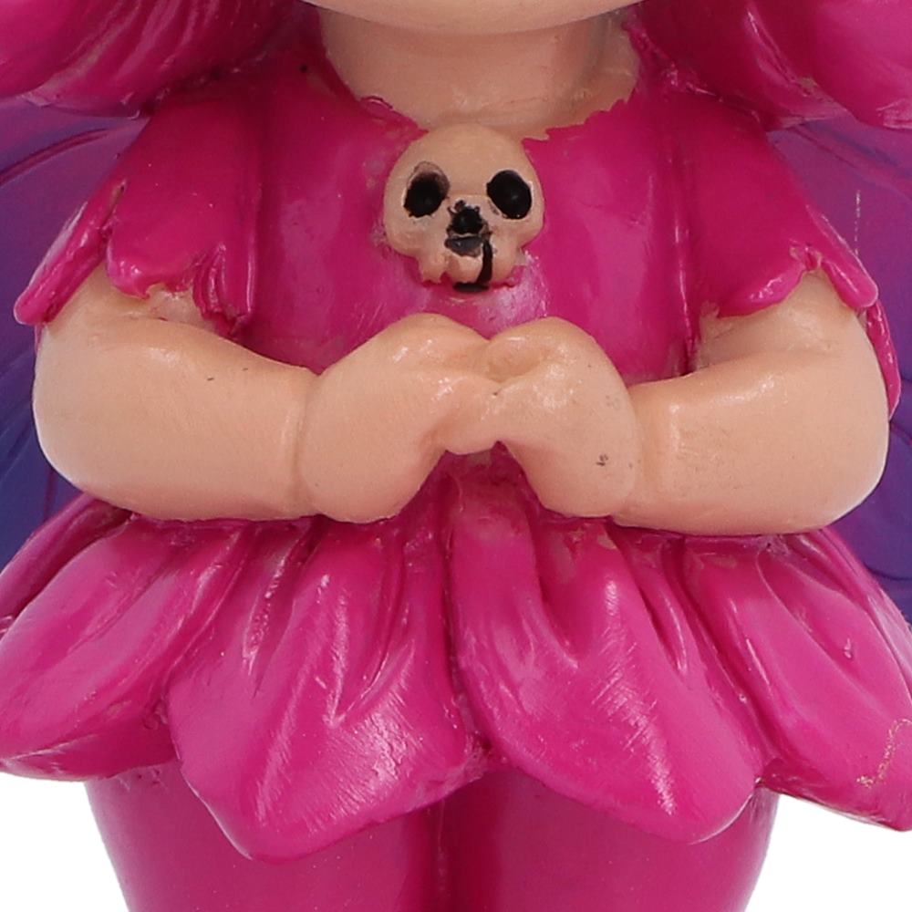 Close-up of Spirit Fairy Beatrix fairy figurine with pale skin, wearing a shiny bright pink dress and matching hair, with a small skull ornament at the center of the chest.