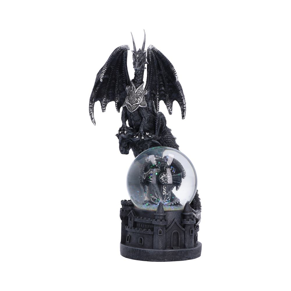 Front view of Dragon’s Dominion Snow Globe with winged dragon and castle-wall details