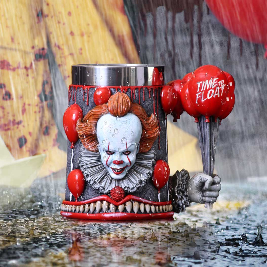 A red tankard with a depiction of Pennywise the clown from IT, surrounded by red balloons, and the text 'Time to float on display